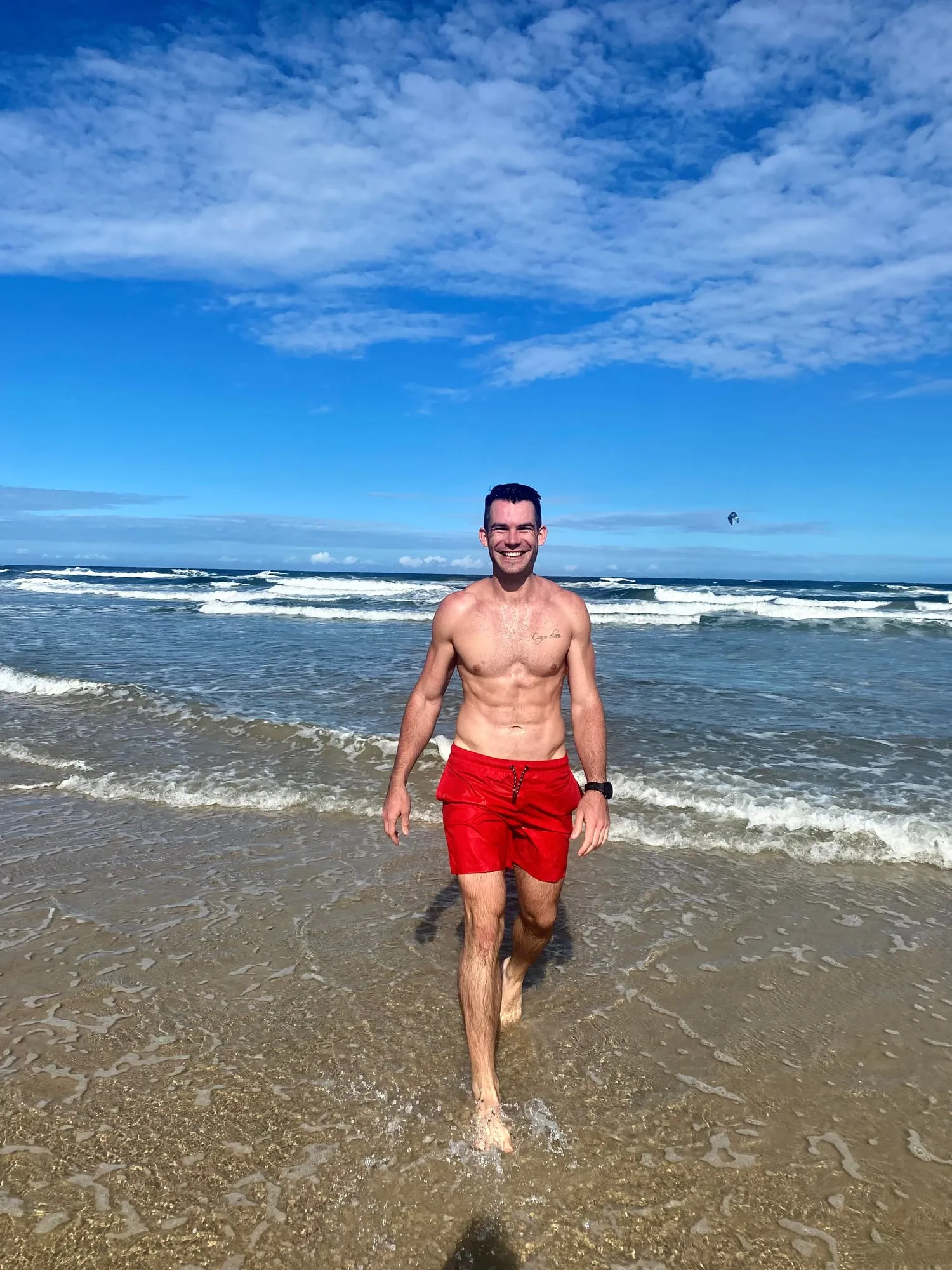 Richard walking out of the surf on a Sunshine Coast beach